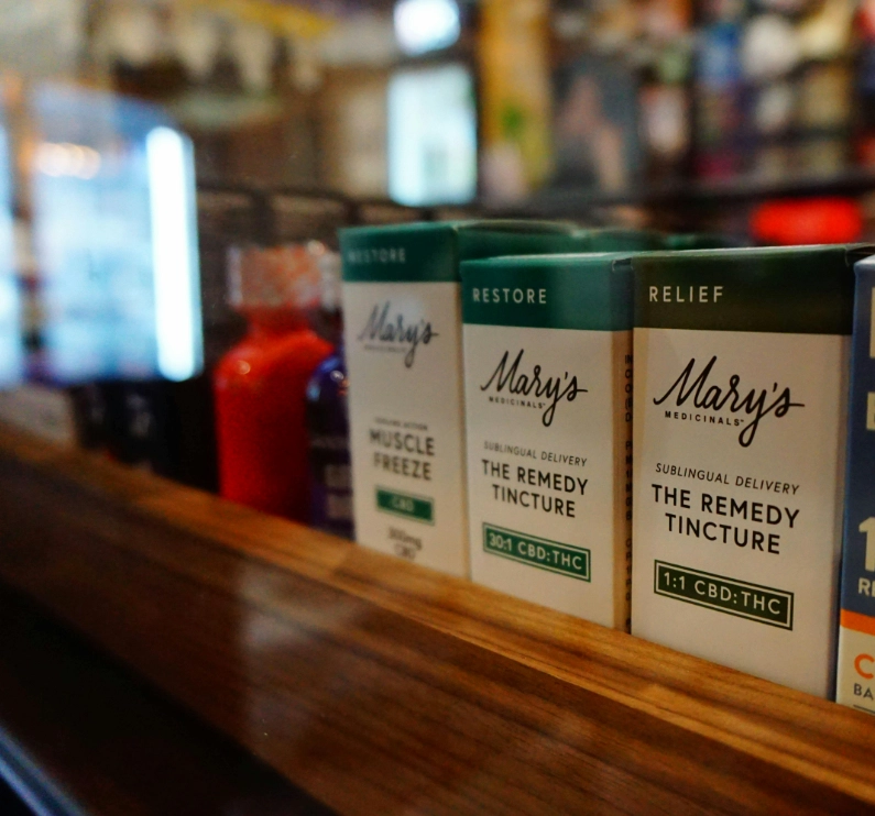 Mary's medicinals boxes displayed behind the counter at Electric Avenue.